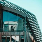 A man standing on a balcony of a building